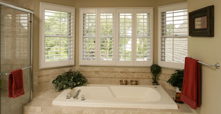 Plantation shutters in Sacramento bathroom.